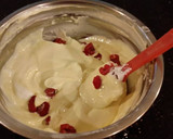 A picture of step 6 of White Layer Cake with a Raspberry Swirl Cheesecake center layer and a Raspberry Cream Frosting.