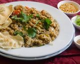 A picture of step 5 of KODO MILLET SAMBAR SATHAM WITH GREEN BELL PEPPERS, TOMATO AND SMALL ONIONS.
