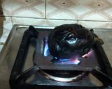A picture of step 1 of Baingan ka bharta.