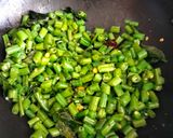 A picture of step 2 of French beans poriyal.