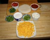 A picture of step 1 of NACHOS WITH GOAT CHEESE, AVOCADO, AND SOUR CREAM.