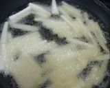 A picture of step 2 of Yam fries paired with peppered shrimp sauce.