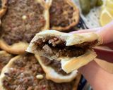 A picture of step 8 of Lebanese homemade meat pies/ Lahm bi Ajeen or Sfiha.
