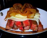 A picture of step 5 of Mike's Steak Cheese Onion & Mushroom Man-wich.