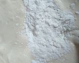 A picture of step 2 of Sponge cake filled with chunky blue berry jam.