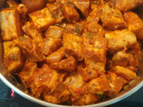 Guiso de patatas, arroz con costillas de cerdo adobadas