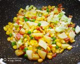 A picture of step 2 of Brown Rice with lots of veggis.