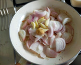 A picture of step 2 of Kanda-Lasoon Masala.