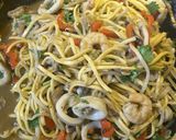 A picture of step 1 of Thai style seafood with noodles.