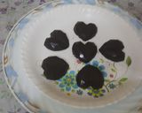 A picture of step 3 of (meethi recipe)Small pinnata heart shape dark chocolates.