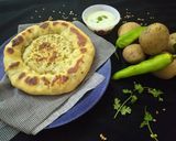 A picture of step 18 of Aloo kabab naan without oven serve with raita.