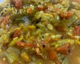 A picture of step 6 of Turaii (Ridge gourd) with kalonji and curry leaf.