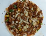 A picture of step 4 of Chicken tikka pizza.