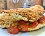 A picture of step 6 of Cheddar, Broccoli and Red Chilli Soufflé Omelette, Garlic roasted Cherry Plum Tomatoes, Olive Oil.
