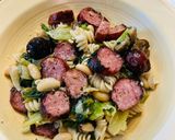 A picture of step 8 of Smoked Chicken sausage, Escarole and beans over quinoa and brown rice pasta.