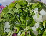 A picture of step 1 of Radish capsicum sring onion junka by Shobha Rathod (green sabji).
