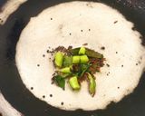 A picture of step 2 of Ash gourd Thoran.