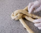 A picture of step 11 of Soft Chewy Braided Raisin Bread.