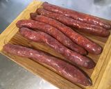 Une image de l'étape 1 de Merguez aux poivrons rouges, échalotes et herbes.
