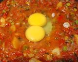 A picture of step 5 of Shakshuka (In my style- Poached eggs in tomato and veggie gravy).