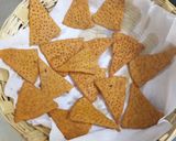 A picture of step 5 of Lentil Nachos with salsa and sauce.