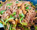 A picture of step 7 of Stir-Fried Brown Rice Pho with Octopus & Mustard Greens.