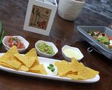A picture of step 4 of Cheese nachos with salsa and guacamole.