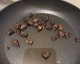 A picture of step 6 of Simple risotto base topped with scallops and black pudding.