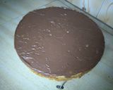 A picture of step 16 of Banana nut cake with chocolate frosting.
