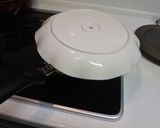 A picture of step 7 of Easy Apple Cake with a fry pan.