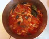 A picture of step 4 of Thai Lemongrass Tomato Seafood Hot and Sour Soup.