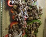A picture of step 4 of Philly Cheesesteak stuffed Peppers.