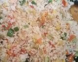 A picture of step 10 of Thai style fried rice with pineapple.