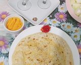 A picture of step 4 of Daal bhari roti with mango lassi.