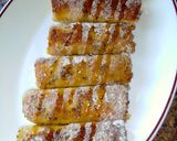 A picture of step 10 of Banana French toast roll ups with peanut sauce. #breakfastideas.