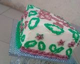 A picture of step 11 of Vanilla & chocolate marble Christmas themed cake.