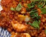 A picture of step 8 of Fregola sarda with prawns, squid, scallops, blue eye cod and light tomato sauce.