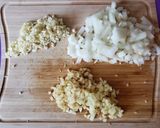 A picture of step 1 of Chicken Arroz Caldo.