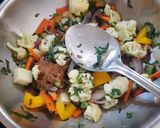 A picture of step 2 of Cheesy Mix veggies in white sauce.