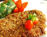 Foto del paso 5 de la receta: Milanesas estilo peruanas a la chapa con buñuelos de acelga y tomates cherrys