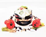 Foto del passaggio 5 della ricetta Parmigiana di spigola con terra di olive taggiasche e pinoli