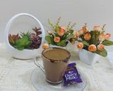 A picture of step 9 of Caramel hot coffee chocolate with cream.