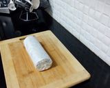 A picture of step 11 of Biscuits Meethi (Swiss roll style).