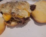 A picture of step 3 of Smothered and Covered Smash Burgers on Hawaiian Buns.