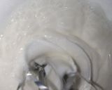 A picture of step 2 of Cake with meringue buttercream frosting & Fondant flowers.