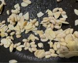 A picture of step 2 of Zucchini Spaghetti with Basil Pesto, Crumbled Feta, Almonds, and Pine Nuts.