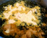 A picture of step 7 of Sarso ka saag with makki roti.
