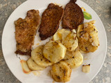 Cinta de lomo de cerdo en adobo al horno con papas panaderas