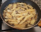 A picture of step 6 of Cassava Crisps infused with Garlic.