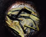 A picture of step 1 of Baingan and Aloo fry.